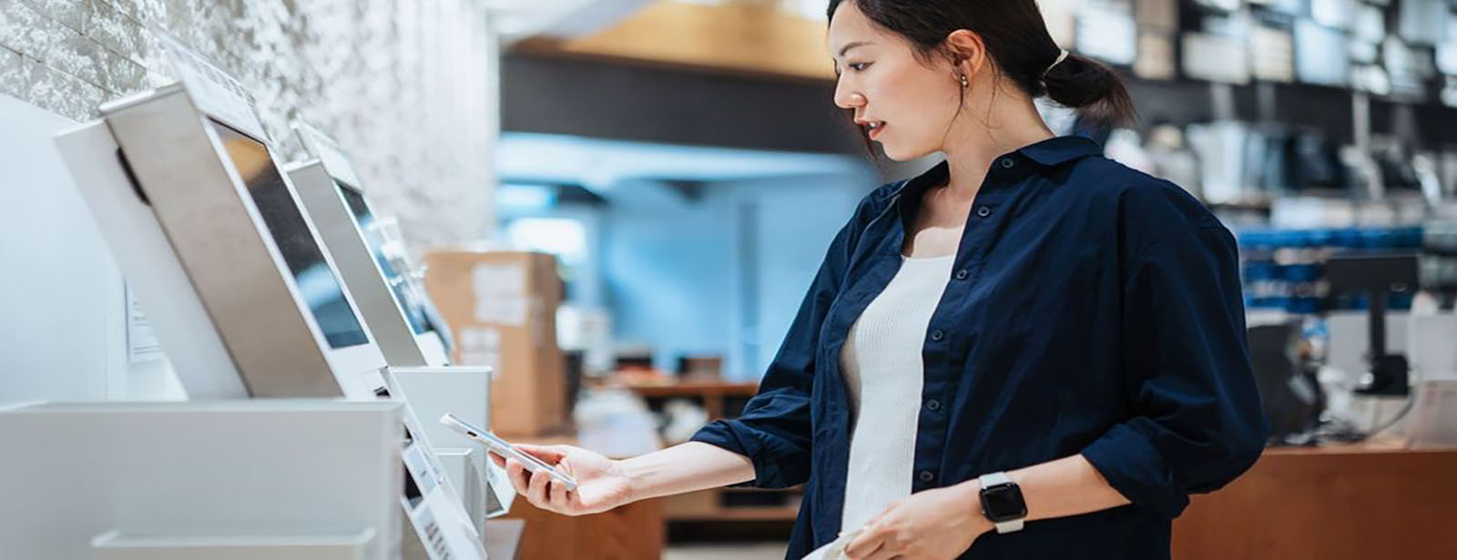 Mature hispanic couple looking at each other while using a tablet device